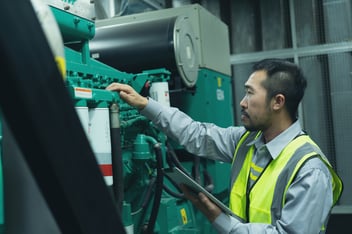 Field Service Engineer fixing a Power Generator